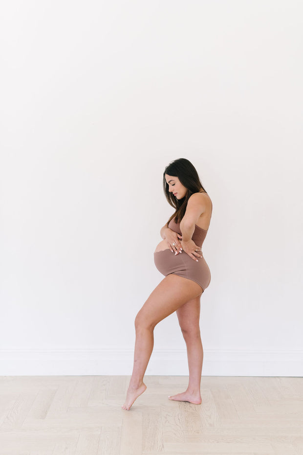 Premium Photo  Cropped view of unrecognizable woman in beige underwear  laying her hands on her stomach with relaxed muscles that have lost their  tone and stretch marks after pregnancy and childbirth